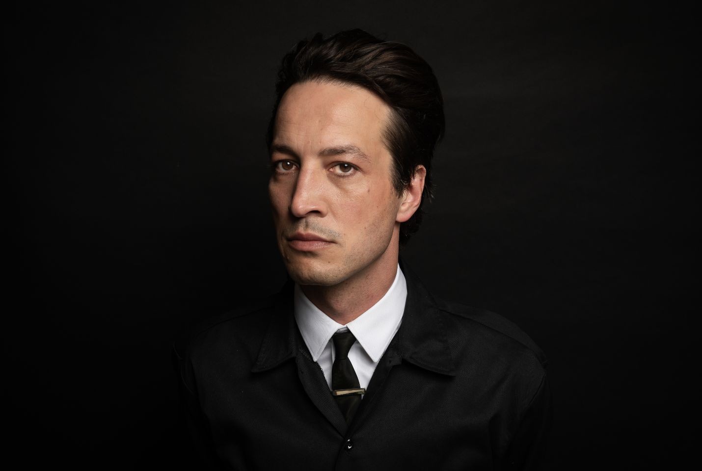 Marlon Williams in a black suit
